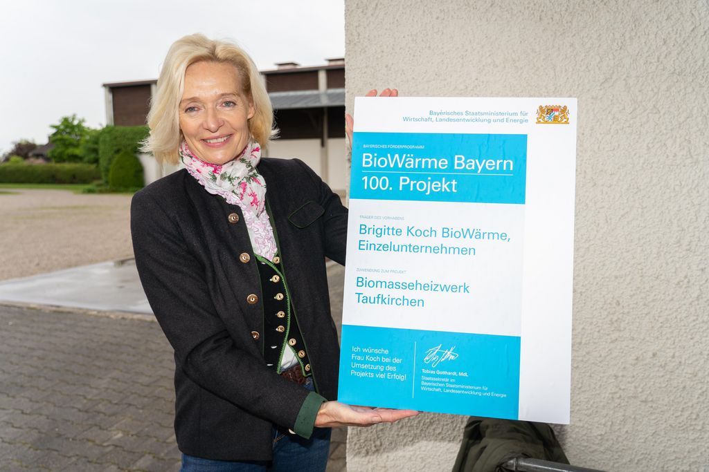 Impressionen der Übergabe des 100. Förderbescheids im Programm BioWärme Bayern.